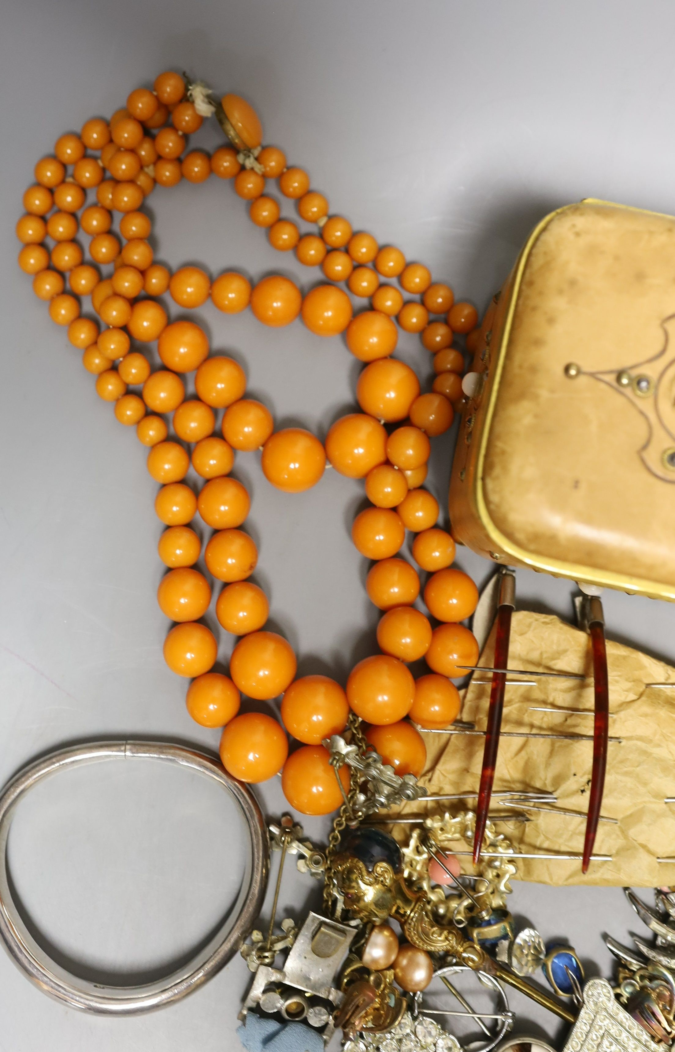 A 19th century calf skin and cut steel mounted trinket box and assorted costume jewellery, including a malachite necklace.